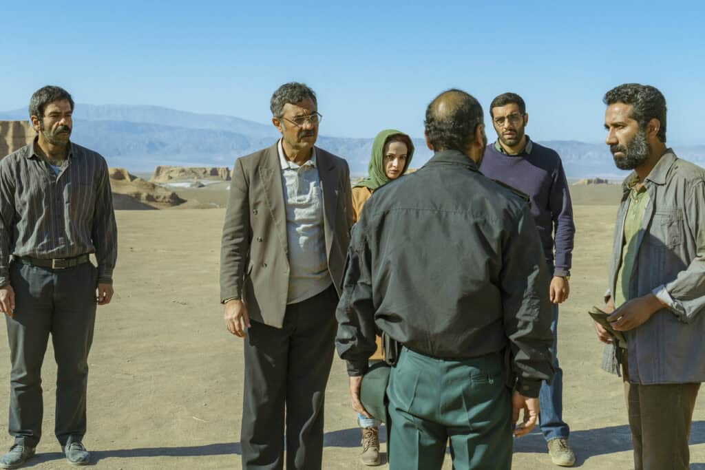 Scene from Cause of Death: Unknown, directed by Ali Zarnegar — Iranian road drama exploring moral choices among stranded travelers in the desert.