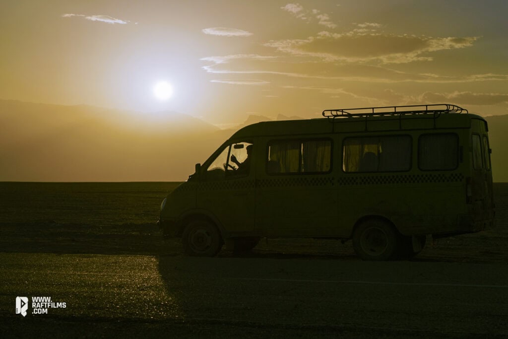 A van in the Iranian desert at sunset from Ali Zarnegar’s film Cause of Death: Unknown – Iran’s Oscar submission, distributed by Raft Films.